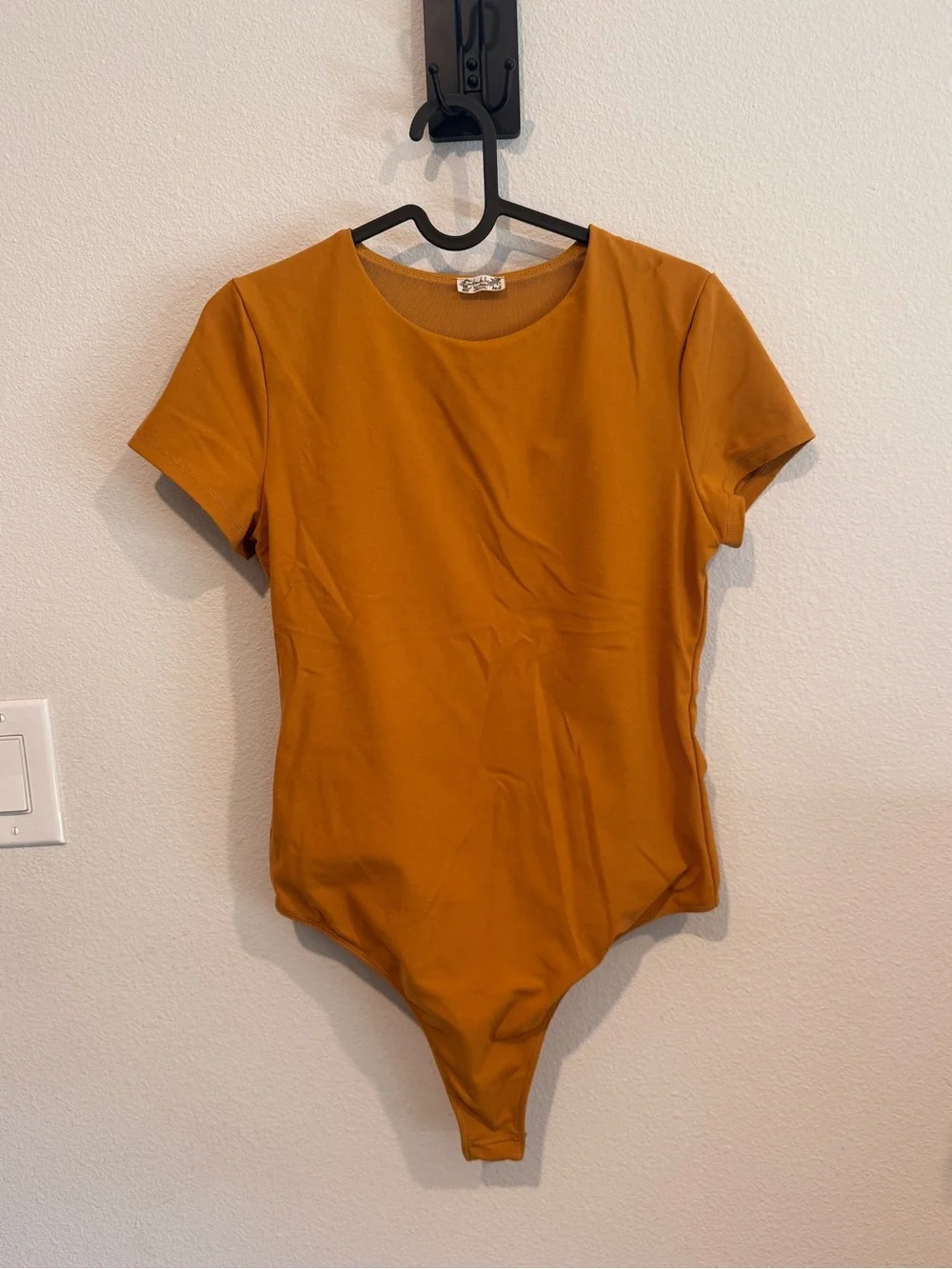 Free People Alexis Tee Bodysuit in a mustard